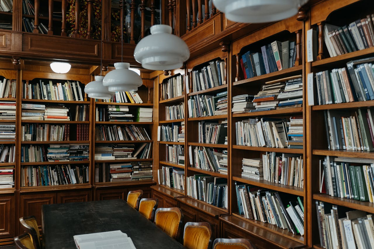 A serene library with wooden shelves filled with books, creating a cozy academic atmosphere.